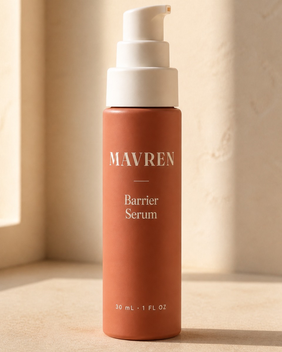A close-up of the serum bottle, label sharp, on warm stone